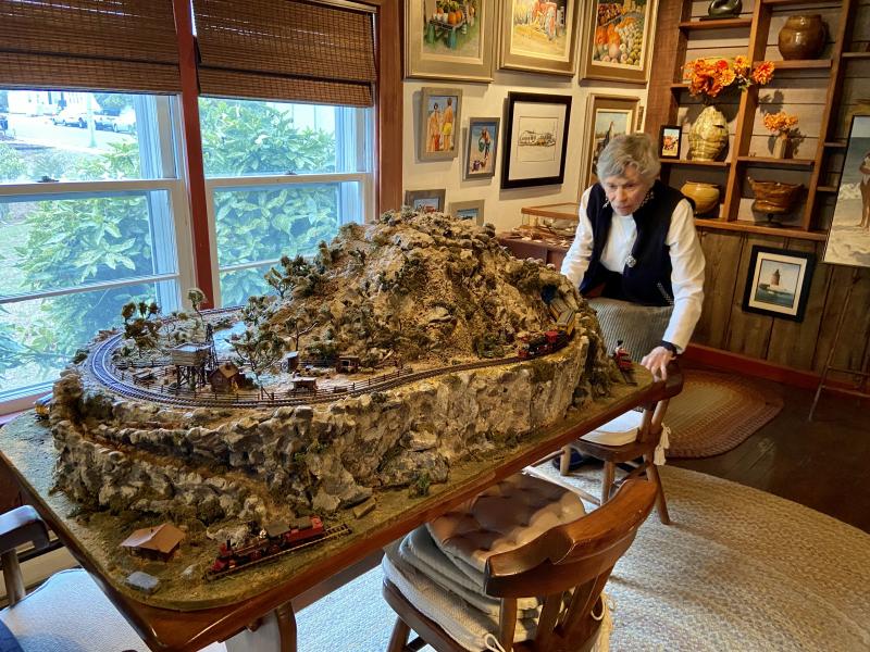 Petterson created this small-scale model railroad mountain scene. The top is removable for the easy placement of a Christmas tree.